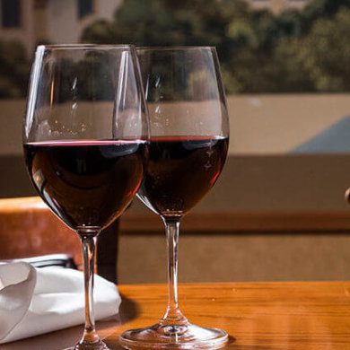 Wine bottle and two glasses of red wine